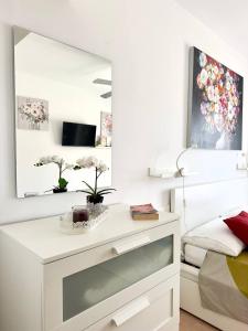 a bedroom with a dressing table and a mirror at El beso del mar in Costa de Antigua +25 photos