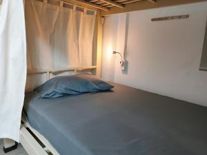 Postel nebo postele na pokoji v ubytování Bandlive Backpacker Hostel