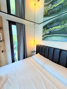 Postel nebo postele na pokoji v ubytování 446 Tiny House Shirokë