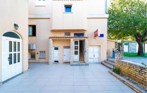 a house with white doors and a courtyard at 1 Bedroom Nice Apartment In Krusevo in Kruševo