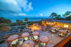 an overhead view of a restaurant with tables and umbrellas at 26 Muirfield Road at The Sea Pines Resort in Hilton Head Island