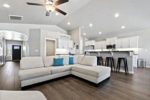 a living room with a couch and a kitchen at Nampa Gem Near Lake, Dining & Downtown Fun in Nampa