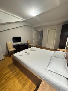 Voodi või voodid majutusasutuse Apartments Philip II toas