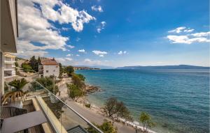 a view of the ocean from the balcony of a building at Stunning Apartment In Crikvenica in Crikvenica
