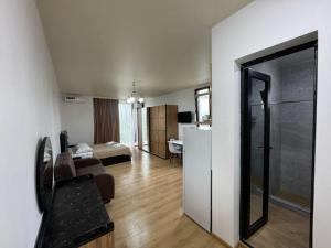 a room with a living room and a bedroom at Bala Guesthouse 327 in K'obulet'i