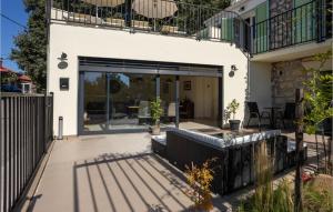 an external view of a house with a patio at Cozy Home In Grizane-Belgrad in Grižane +28 photos