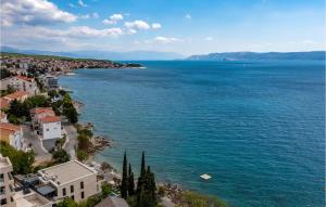 an aerial view of a town and the ocean at Beautiful Apartment In Crikvenica in Crikvenica +26 photos