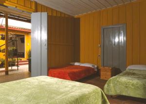 Postel nebo postele na pokoji v ubytování Hostal Juan Páramo