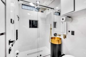 a bathroom with a shower and a glass door at Modern Mountain Luxury Soak, Stay, & Be Spoiled in Shaver Lake +37 photos