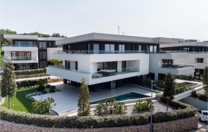 an aerial view of a house with a swimming pool at Lovely Apartment In Malinska in Malinska