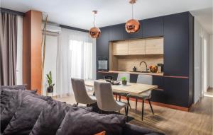 a kitchen and dining room with a table and chairs at 8 Bedroom Gorgeous Home In Zadar in Zadar