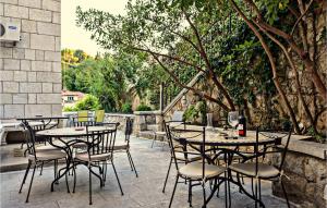 a group of tables and chairs on a patio at Villa Mediteran in Dubrovnik +26 photos