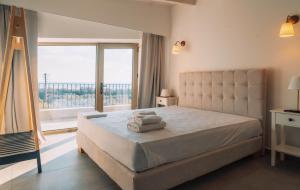 A bed or beds in a room at Villa Riza Még 37 kép