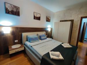 Postel nebo postele na pokoji v ubytování Petra Apartment, free parking