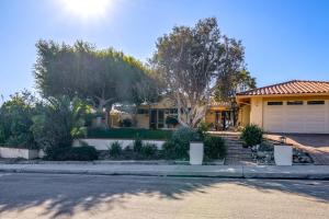 a yellow house with trees and a driveway at Less Than 1 Mi to Beach and Pepperdine Airy Malibu Studio in Malibu