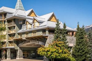 a large building with a tower on top of it at Cascade Lodge in Whistler