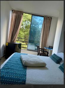 Katil atau katil-katil dalam bilik di Hotel y Apartamentos Montes
