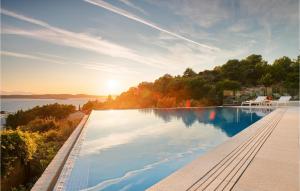 a swimming pool with a view of the water at Villa Afrodita in Hvar +40 photos