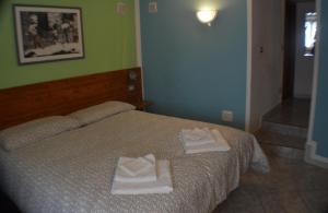 Postel nebo postele na pokoji v ubytování Residence Arvinei