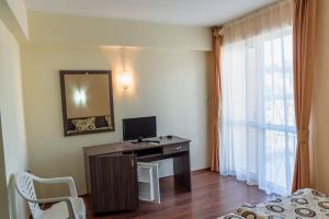 TV a/nebo společenská místnost v ubytování Hotel Ray