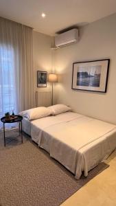 a bedroom with two beds and a table at Andreas and Nelly in Thessaloniki
