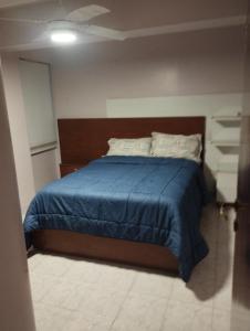 Ένα ή περισσότερα κρεβάτια σε δωμάτιο στο La Mary Tucuman