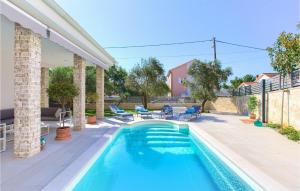 a swimming pool in the backyard of a house at Villa Valentino in Kornić