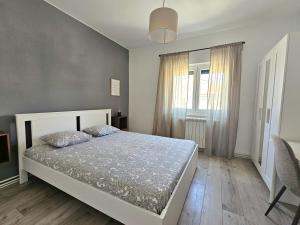 En eller flere senge i et værelse på Apartment Fila