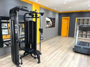 a room with a gym with a treadmill and a treadmill at Appartement à louer in Nouaceur