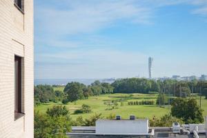 a view of a golf course from a building at Sea & City in Malmö