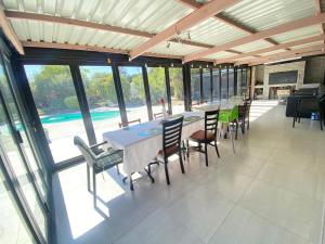 a dining room with a table and chairs at Tranquil Garden Constantiaberg in Sweet Valley