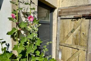 a door with a flower next to a building at Studio for two of 25 m2 in Saint-Xandre in Saint-Xandre