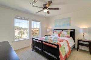 a bedroom with a bed and a ceiling fan at Summer Dayz - Families Love It Here, Just Across from the Beach in Panama City Beach