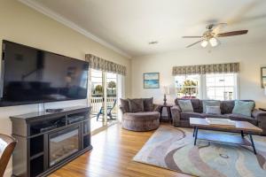 a living room with a large flat screen tv at Summer Dayz - Families Love It Here, Just Across from the Beach in Panama City Beach
