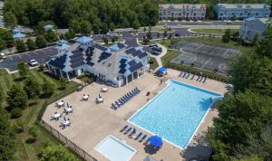 an aerial view of a resort with a pool at Venice court 21675 in Dewey Beach