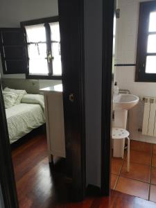 A bed or beds in a room at Mayorazgo De Altamira Mila