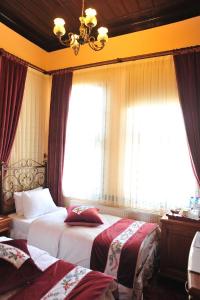 Postel nebo postele na pokoji v ubytování Aksehir Butik Hotel