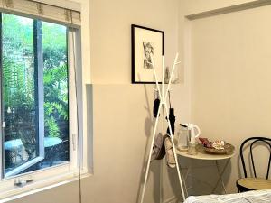 a room with a window and a table and a table at A Gem Downton Montreal in Montreal