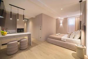 a bedroom with a bed and a kitchen in it at Good Grace Apartments in Zagreb