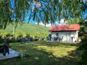 a small white house with a red roof at House Notturno in Otočac