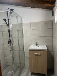 a bathroom with a shower and a sink at Santinho house 2 in Beja +29 photos