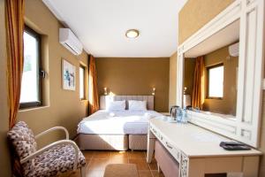 Postel nebo postele na pokoji v ubytování New Hotel Kuč By Marvel