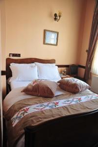 Postel nebo postele na pokoji v ubytování Aksehir Butik Hotel