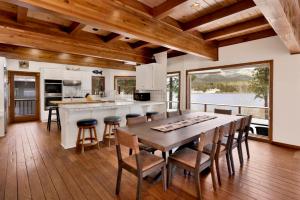 a kitchen and dining room with a table and chairs at Bear Lake Lodge #2547 in Big Bear Lake