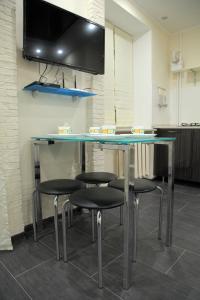 Μια τηλεόραση ή/και κέντρο ψυχαγωγίας στο Studio at Tsentralnyi Prospekt +3 φωτογραφίες