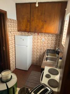 Kuchyň nebo kuchyňský kout v ubytování Aggelakos Rooms