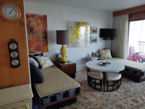 a living room with a couch and a table at Edgewater house 221 in Rehoboth Beach +11 photos