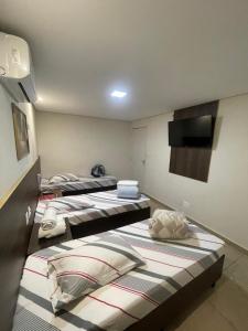Postel nebo postele na pokoji v ubytování Hotel Belenzinho