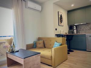 a living room with a couch and a table at Scenic View Studio With Terrace in Torrevieja