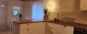 a kitchen with a sink and a counter top at Old Mill in Slavsko Polje +73 photos